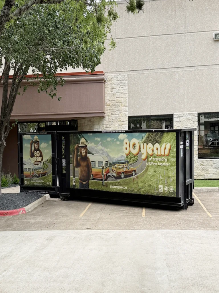 Advertising container parked beside a street